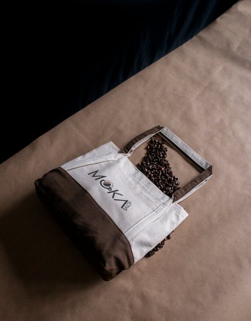 Organic cotton tote with a recycled coffee ink heat transfer.