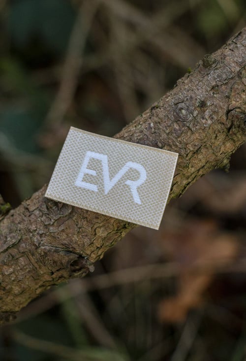 Linen-viscose mix woven label in a beige & white tonal weave.