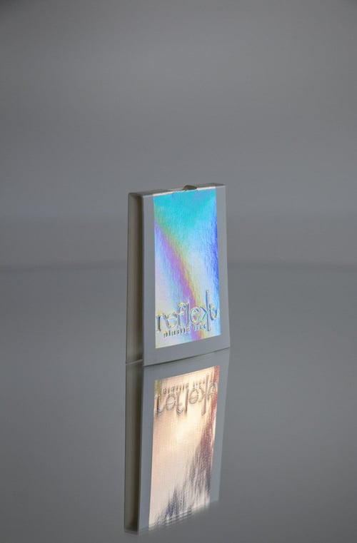 Folded paper overrider with a debossed logo