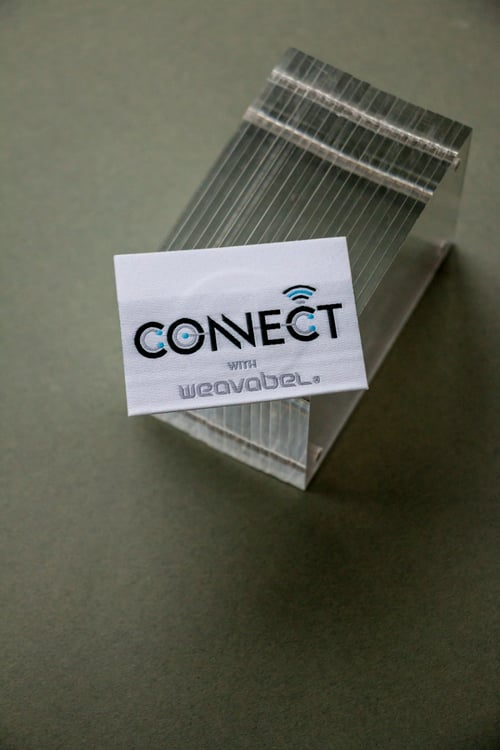 GRS certified polyester woven label with embedded NFC technology.