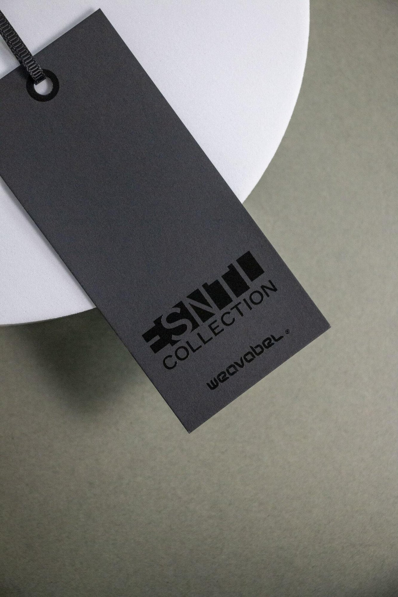 The Essential black swing ticket with spot UV.