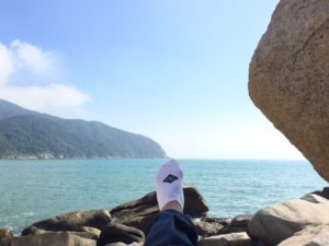 Taking a rest during a walk along the coastline