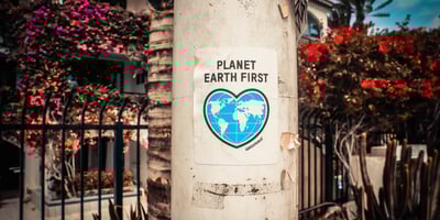 Planet earth first poster on a tree