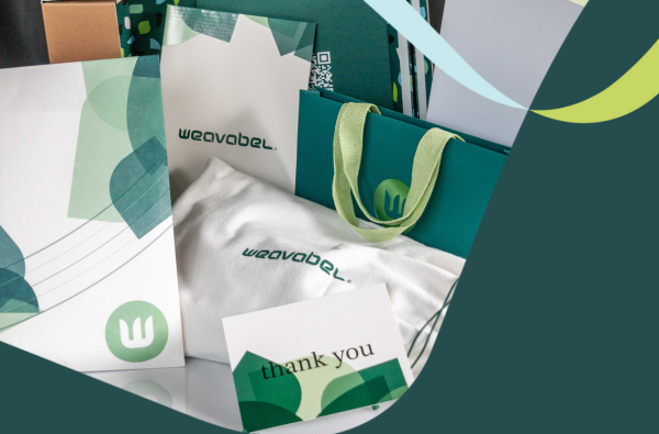 Reusable and recyclable Weavabel branded packaging, including paper bags and pouches, illustrating sustainable packaging solutions aligned with EU PPWR circular economy goals.