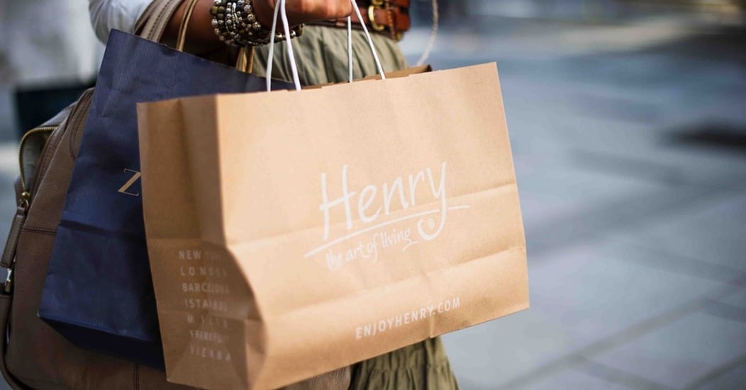 Henry bag being held by a shopper